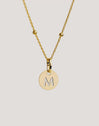 Charm Mini Medallion Letter Acero Baño Oro